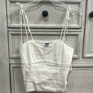 Brand new (with tags) white tank top with ties at the shoulder
